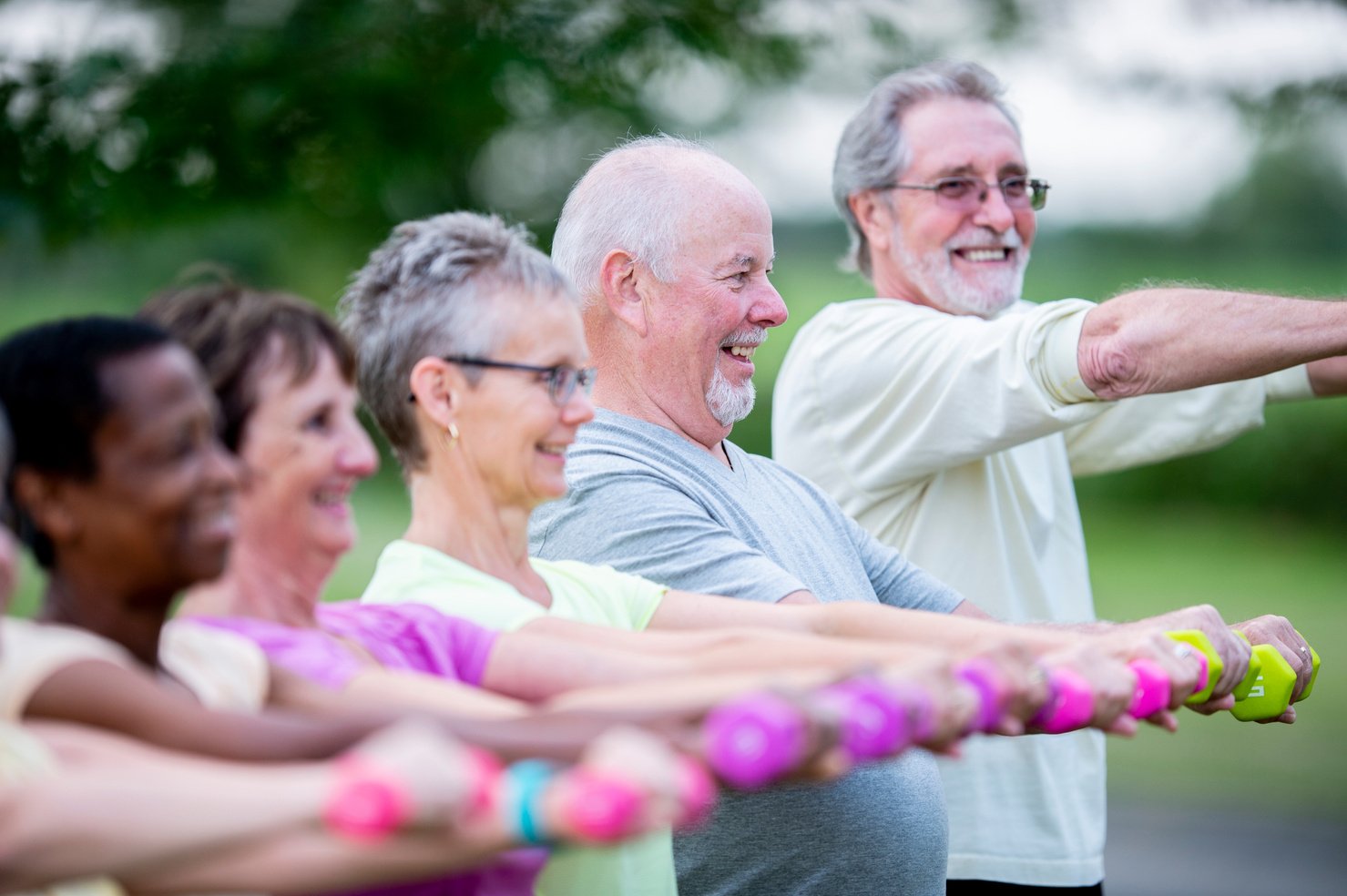 Diverse group of senior citizens exercising together